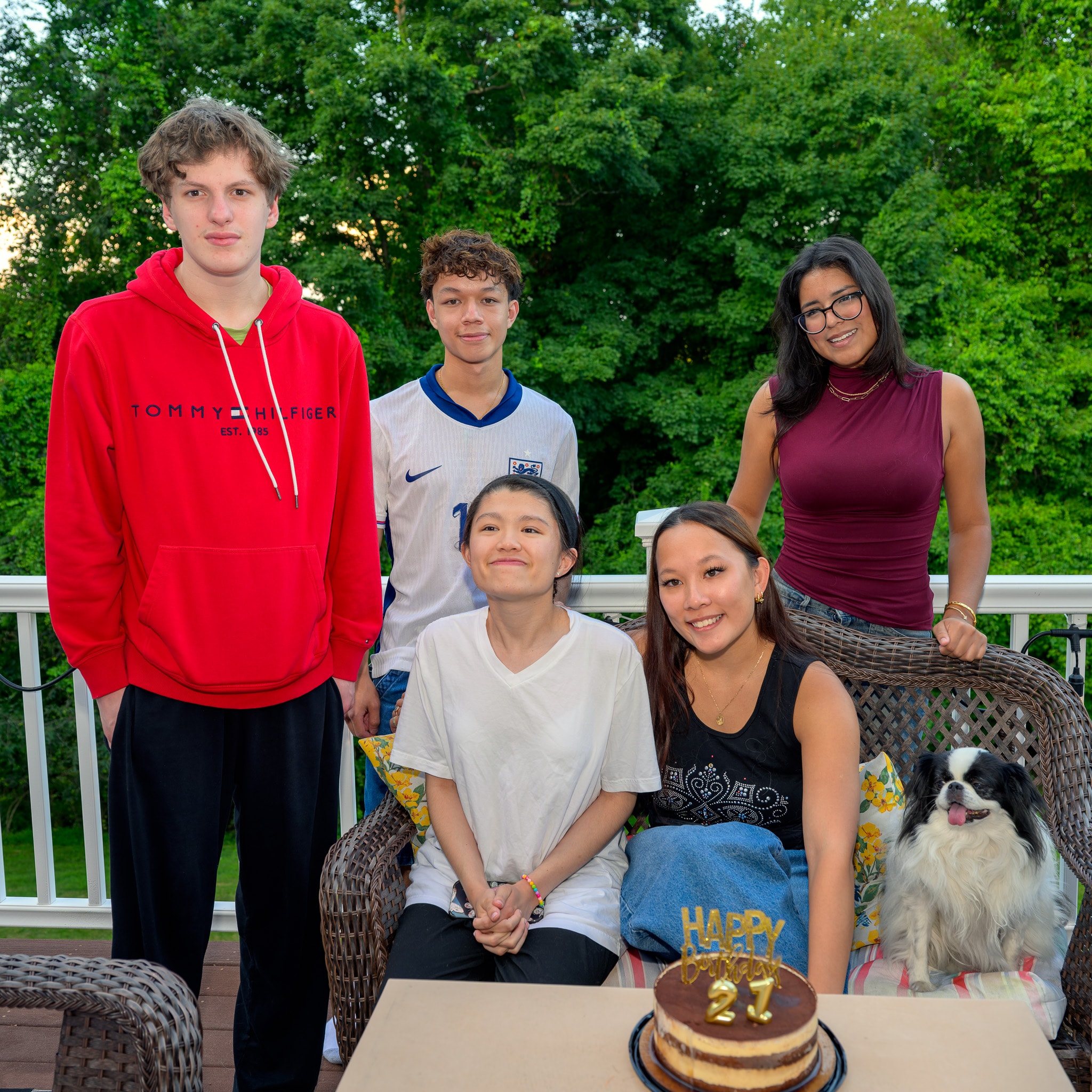 Birthday group photo with dog outdoors