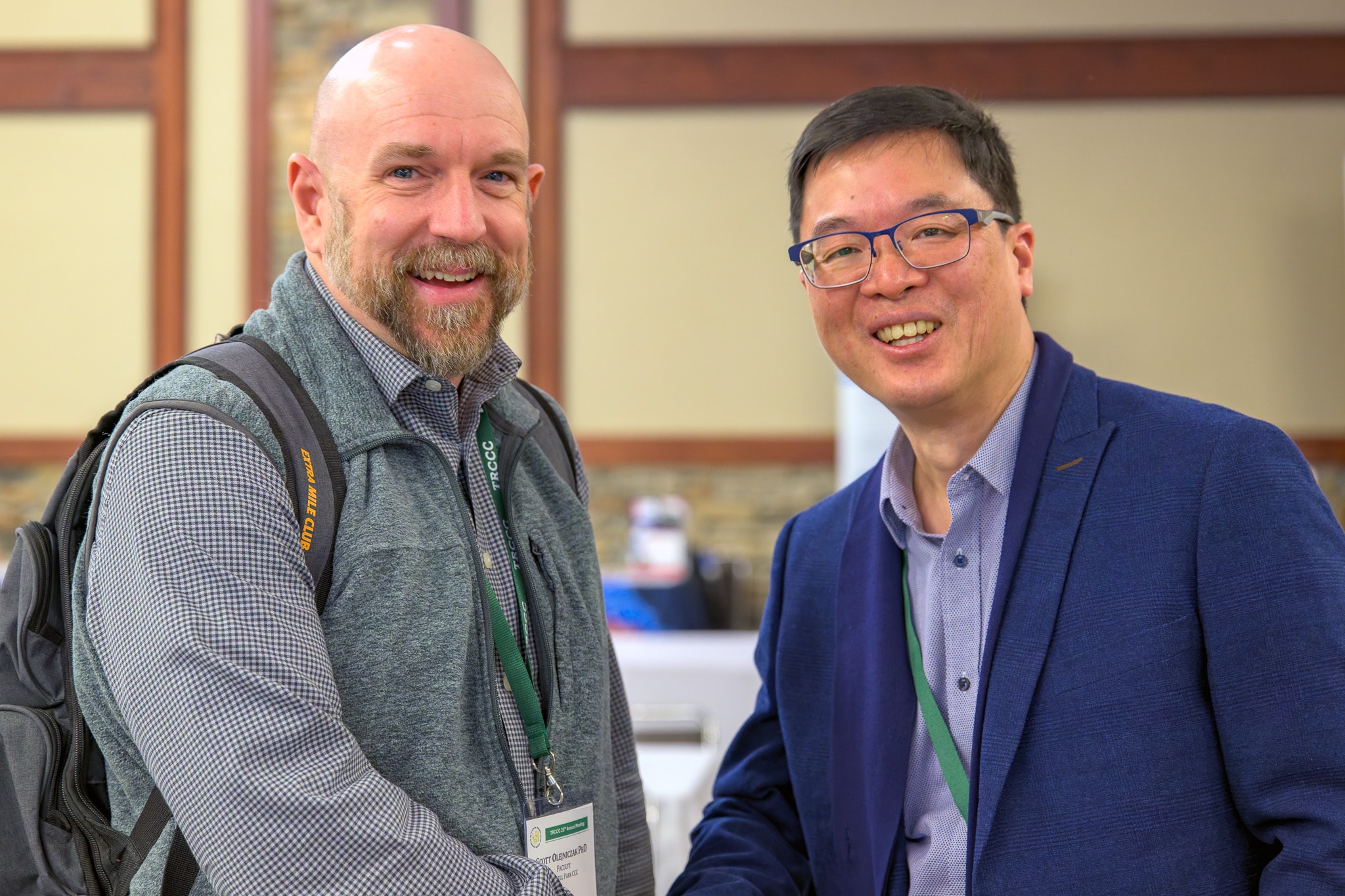 Two attendees smiling at conference