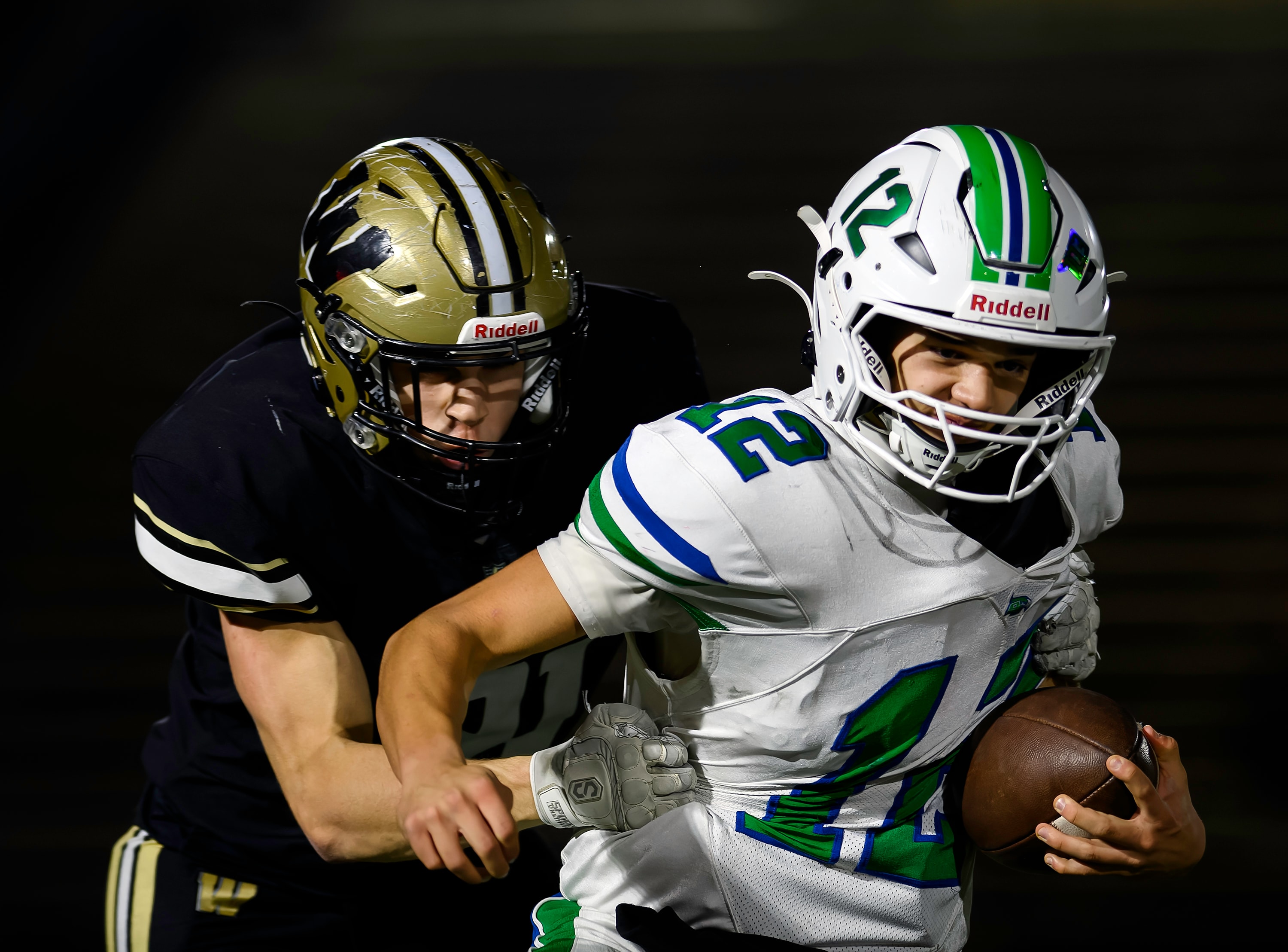 Running back breaks through tackle